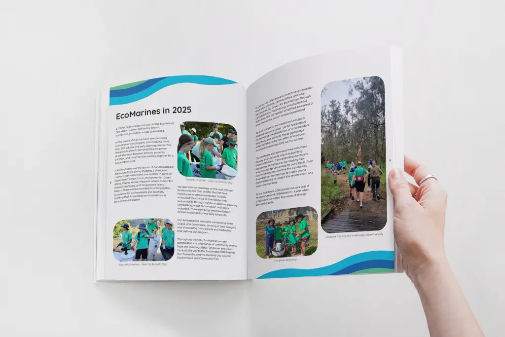 A hand holding an open magazine of EcoMarines "Ripples" end of year publication.